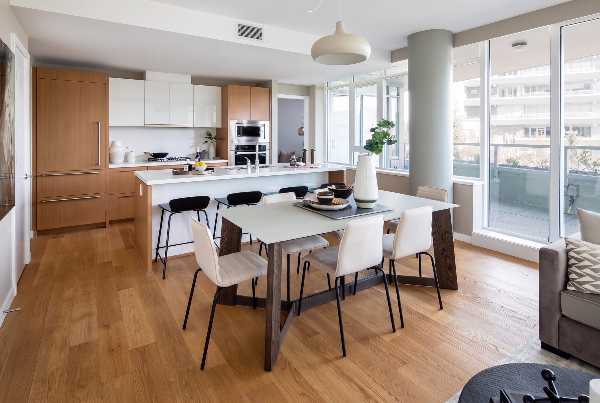 Condo kitchen, dining and living with terrace at Forest Edge, Evelyn, West Vancouver