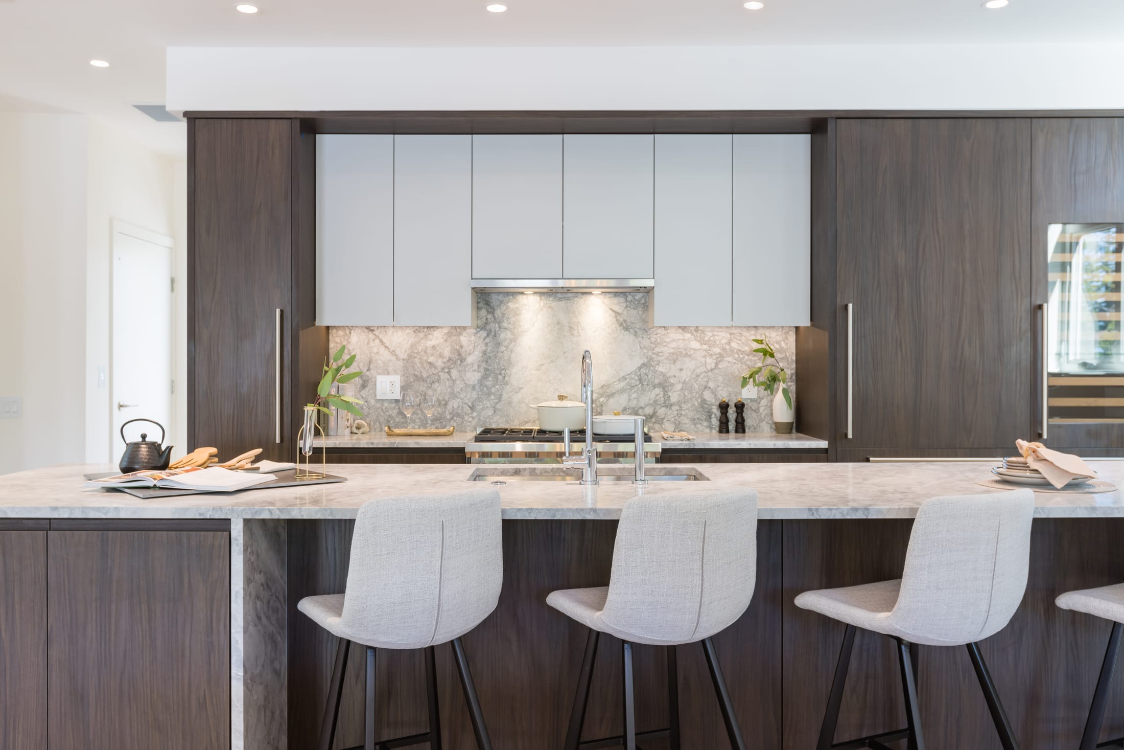 Walnut kitchen with marble backsplash at Evelyn